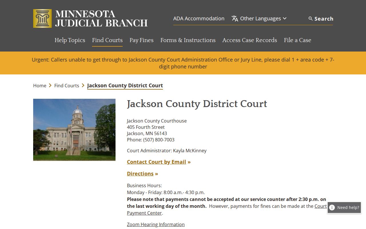 Jackson County municipal court warrant page showing the district court address and hours